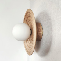 Round wooden wall sconce Natural wood Carved lighting